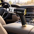 Brushless cordless car vacuum on a car centre console
